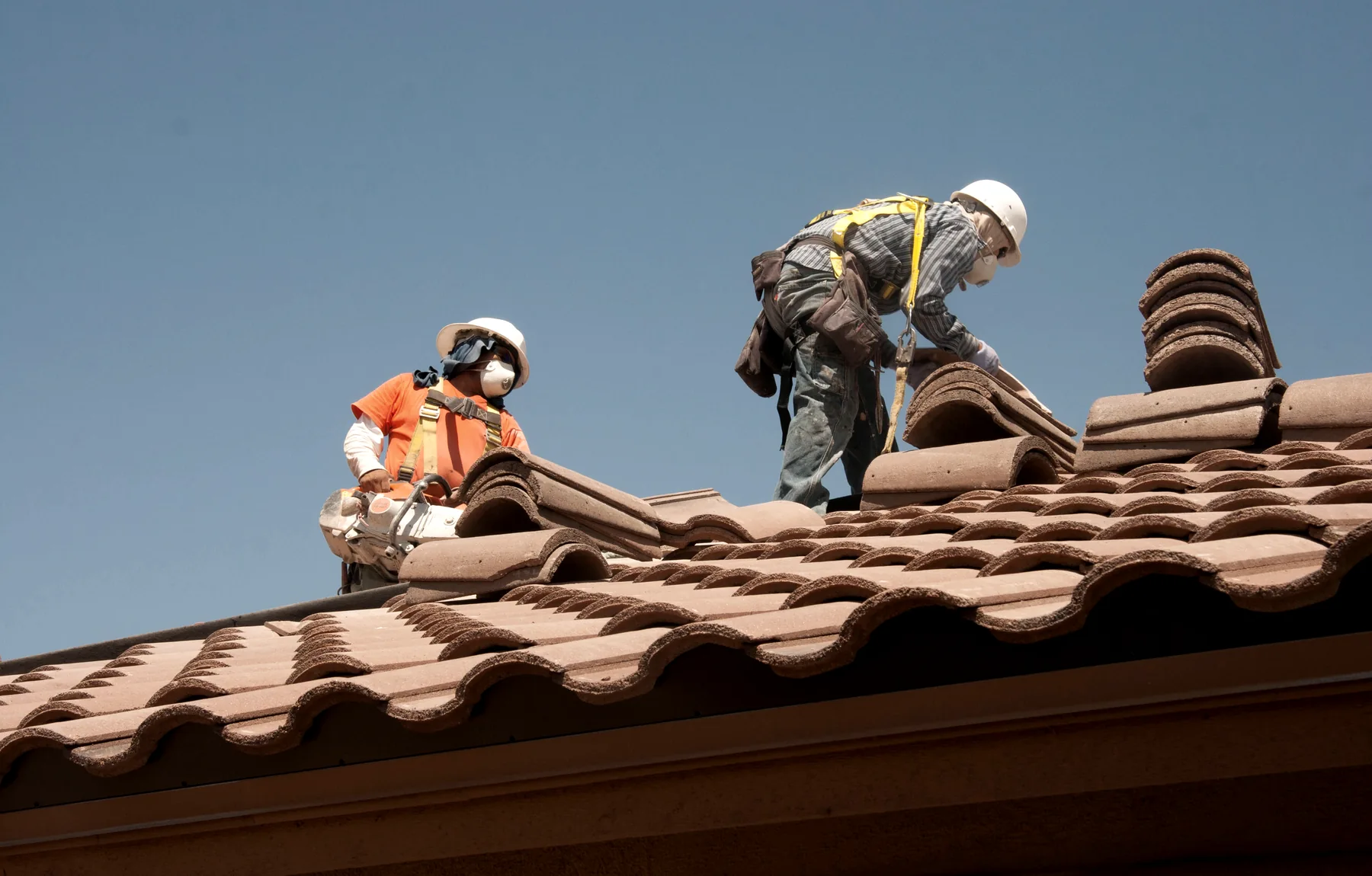 Roofing team completing a project
